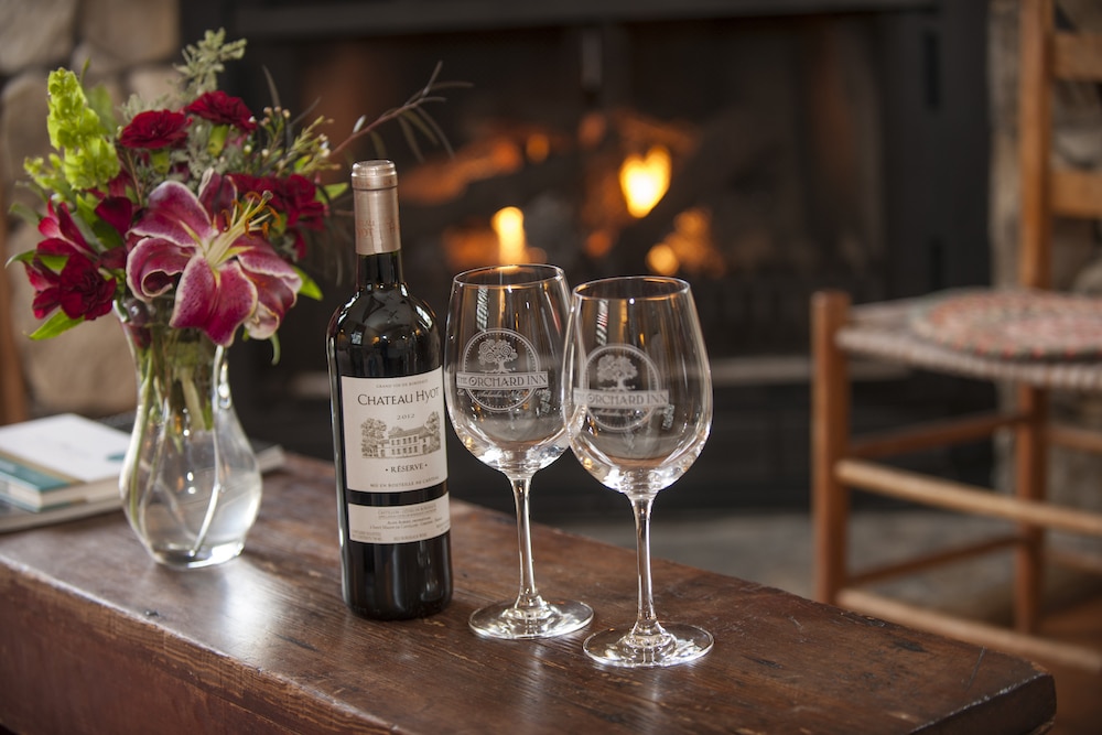 Wine by the fire at our Saluda Hotel, one of the best romantic getaways in North Carolina