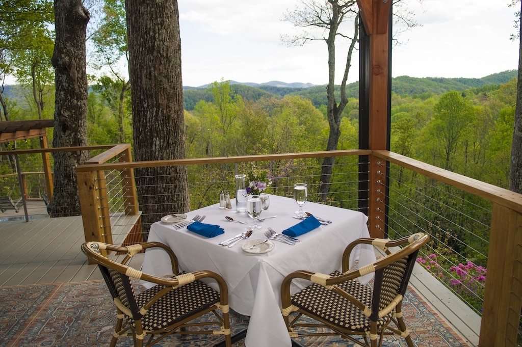 Dine at Newman's Restaurant during one of the most romantic mountain getaways near Asheville. Stay at oneof the best Saluda, NC Hotels and get a dinner view like this. 