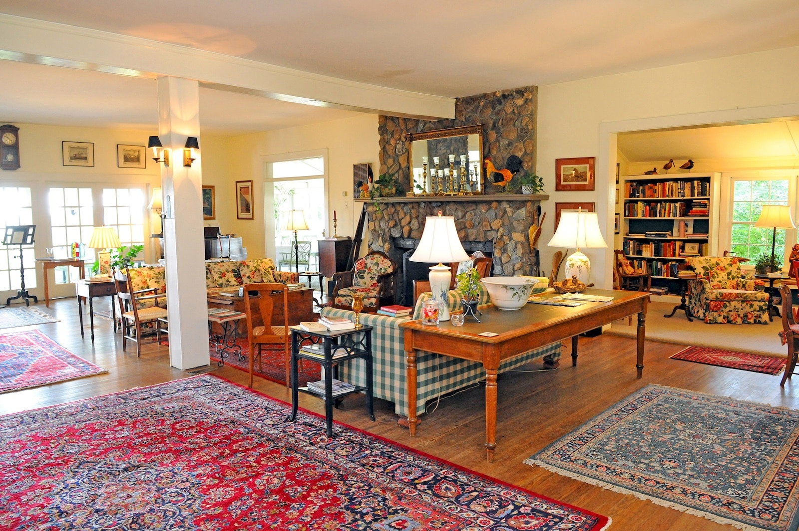 A Bed and Breakfast in Western NC, showcasing a stone fireplace and seating area in the main inn.