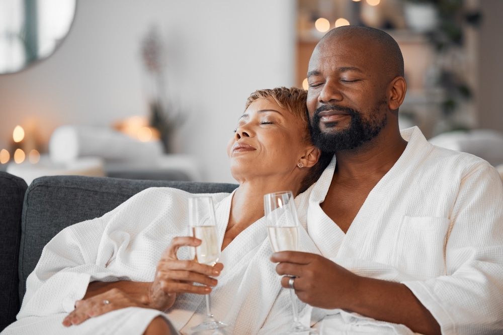 Enjoy one of the best romantic spa getaways at The Orchard Inn and Spa. Couple relaxing with champagne.