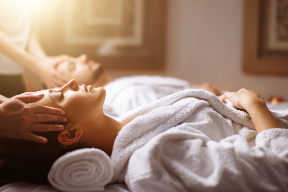 The Orchard Inn and Spa, one of the best Saluda Hotels, offers the best romantic spa getaways in Western North Carolina. Couple enjoying a massage.