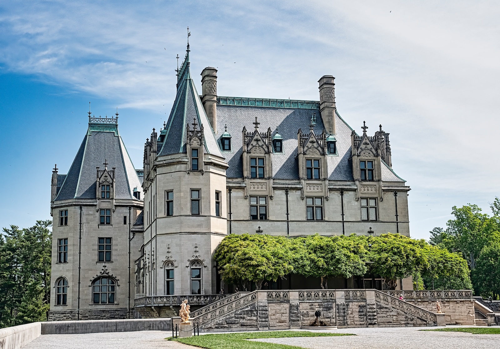 First-Time Visitor's Guide to Biltmore Estate 1 When you buy Biltmore Estate tickets, you'll get access to the grounds and house that looks like a castle, surrounded by greenery and statues.