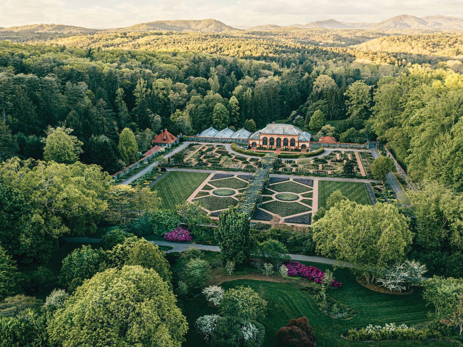 First-Time Visitor's Guide to Biltmore Estate 2 The gardens of the Biltmore Estate with mountains in the background, included in our visit when you buy Biltmore Estate tickets.