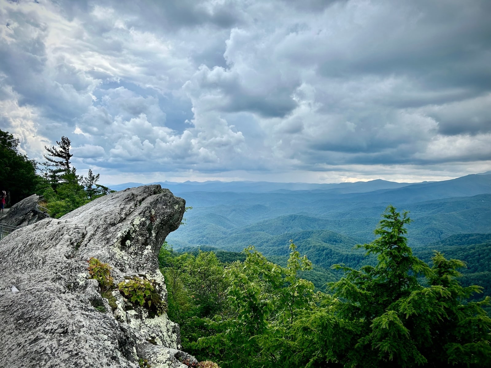 The Best North Carolina Mountain Towns to Explore 2 A popular spot with a rock and Blue Ridge Mountain views in Blowing Rock, one of many beautiful North Carolina mountain towns.
